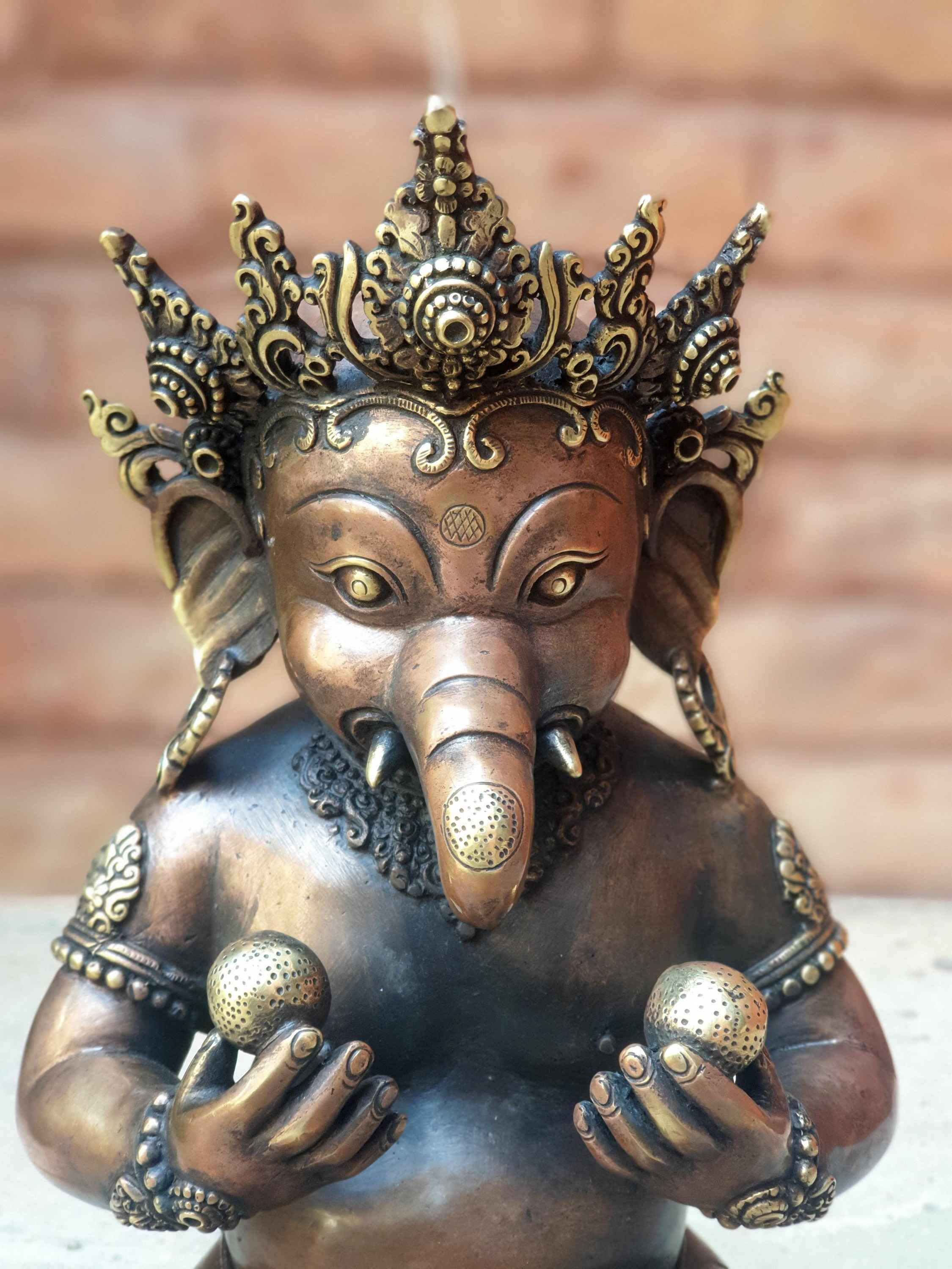 hq Brass Statue Of Baby Sitting Ganesh Holding Two Sweets, antique Finishing