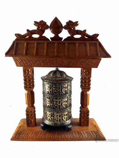 Brass Prayer Wheel On Wooden Temple Frame