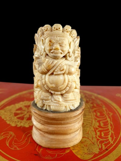 Buddhist Mahakala Carved In Yak Bone, On A Wooden Stand